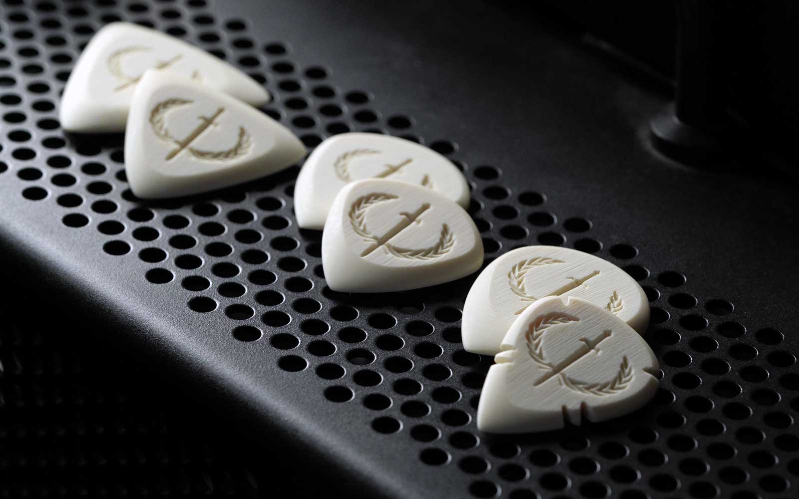 Iron Age Guitar Picks With Grip, gripping, plectrum grip holes, brushed texture