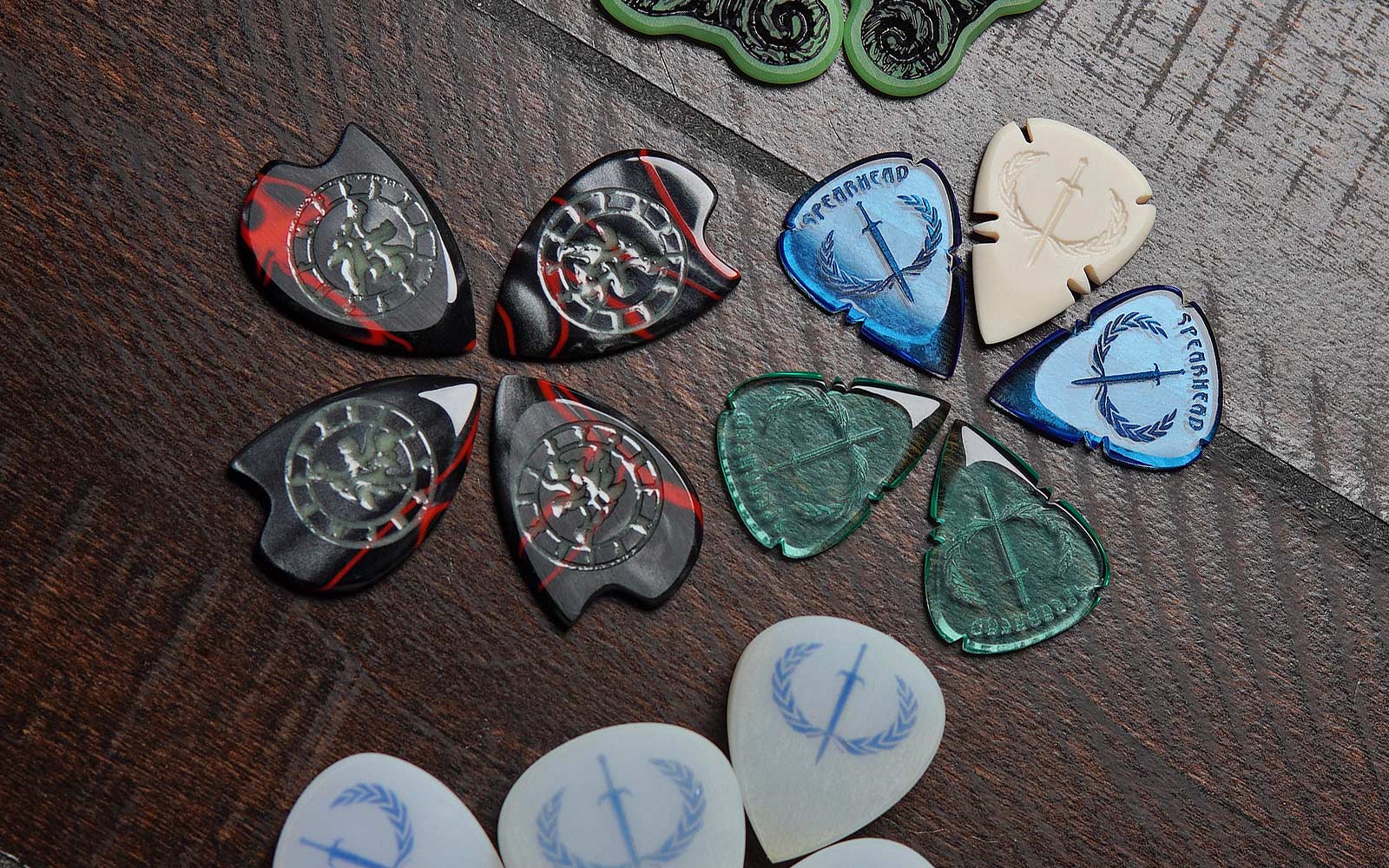 Boutique guitar picks in different materials, shapes, and handmade small-batch designs