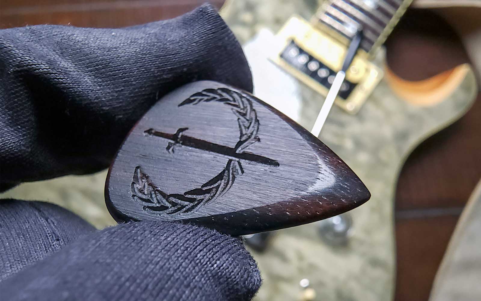 wooden guitar picks, macassar ebony plectrums, handcrafted by iron age guitar accessories