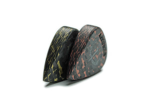 Copper and brass Artificer thick carbon fiber guitar picks showing 7mm side profiles