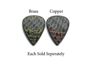 Brass and copper Artificer carbon fiber guitar pick variants shown from the back